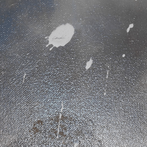Close up of accidentally splashed paint in need of restoration. How to remove spillages and stains on oil paintings