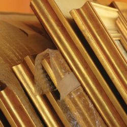 Close up of stacked gold frames - The perils of inadequate storage for artworks