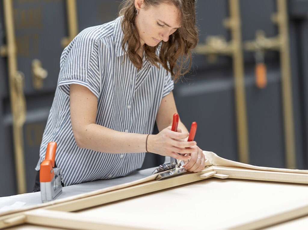 Anna stretching a painting