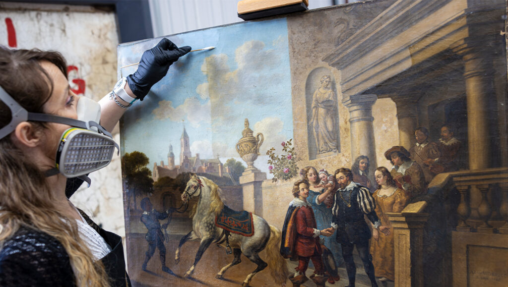 Leonora cleaning canvas