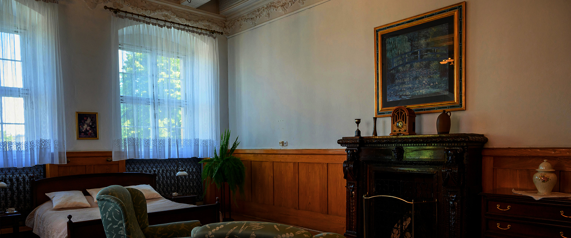 Claude Monet's Bridge over a Pond of Water Lilies print above fireplace.
