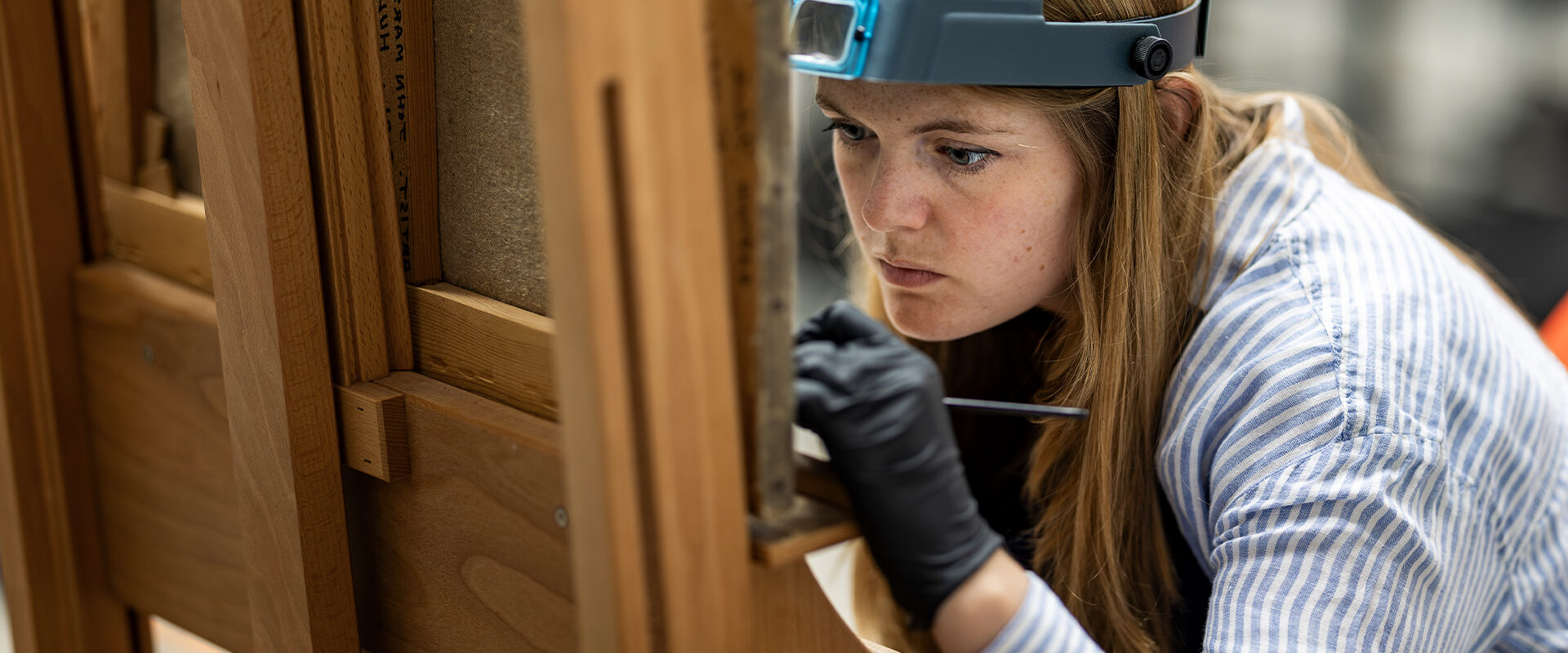 Painting conservator at work